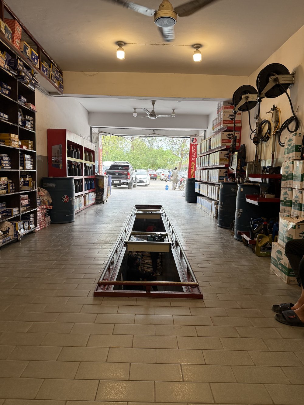 Vehicle in the drive-through bay at Lubri Care Xpress